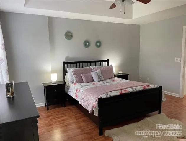 a bedroom with a bed and a desk