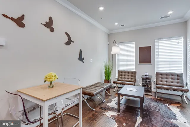 a living room with furniture and a table