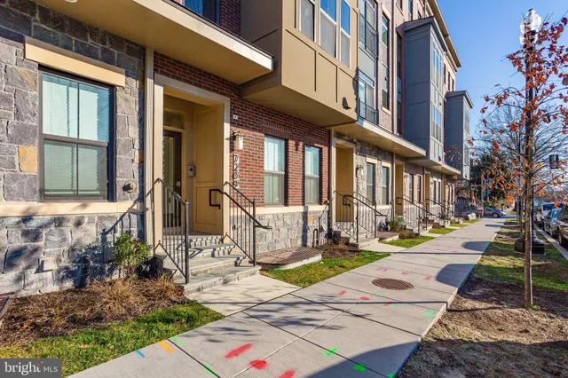 a view of a brick building with many windows
