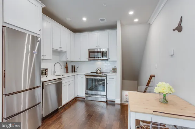 a kitchen with a stove and a microwave