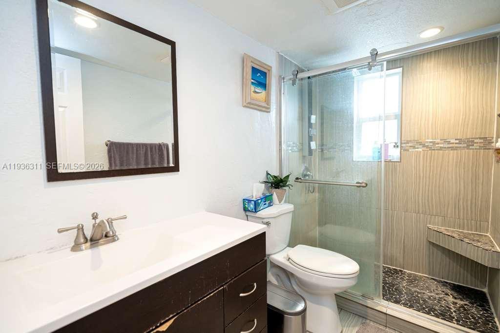 8600 Southwest 109th Avenue, Unit 4114 Miami, FL 33173 - Photo 11 of 44 a bathroom with a sink a toilet and shower