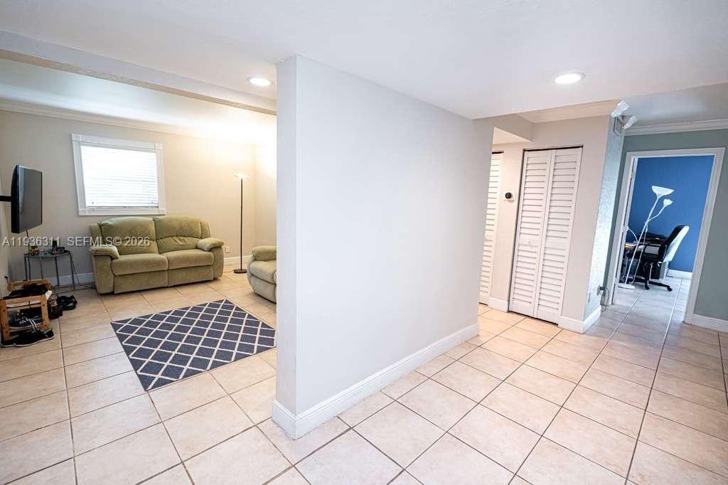 8600 Southwest 109th Avenue, Unit 4114 Miami, FL 33173 - Photo 13 of 44 a living room with a couch and a coffee table