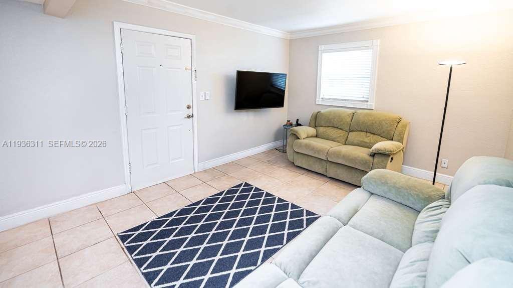 8600 Southwest 109th Avenue, Unit 4114 Miami, FL 33173 - Photo 14 of 44 a living room with furniture and a flat screen tv