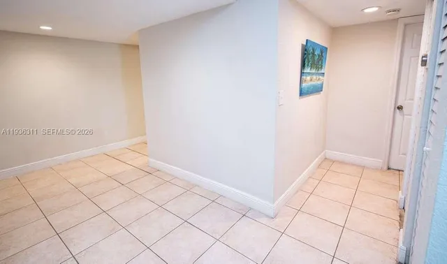 a view of an empty room and window