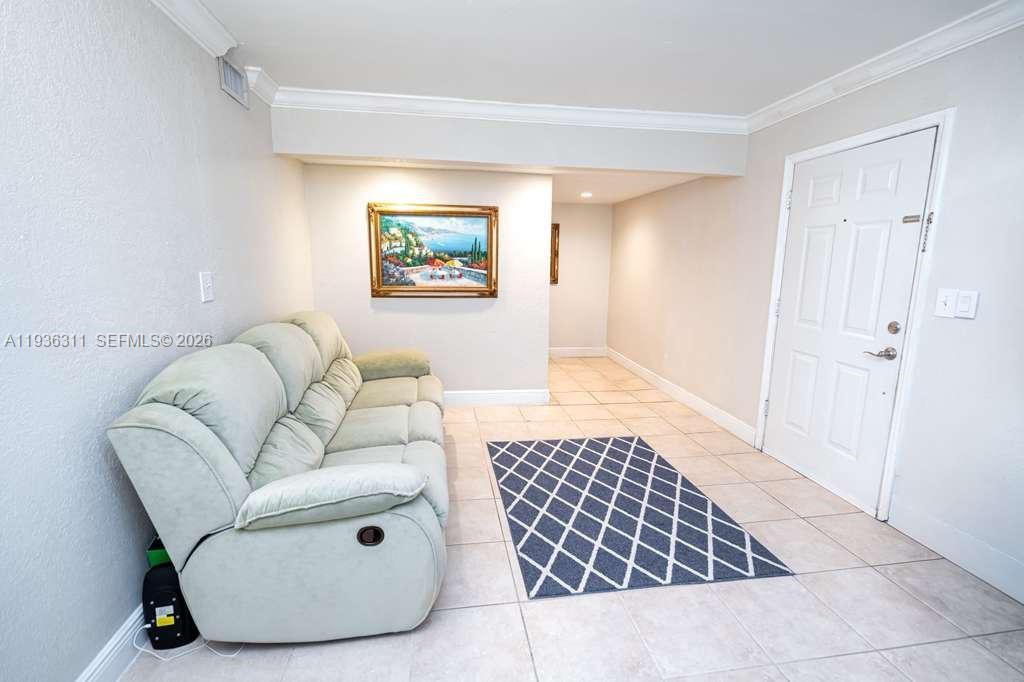 8600 Southwest 109th Avenue, Unit 4114 Miami, FL 33173 - Photo 2 of 44 a living room with furniture and a rug