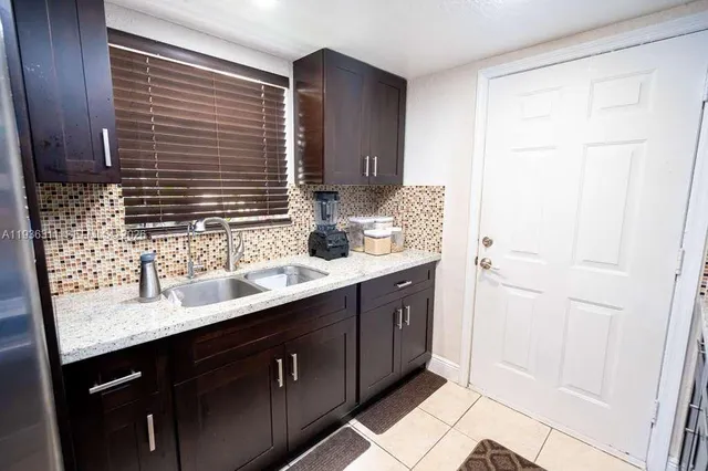 a bathroom with a double vanity sink a and a mirror