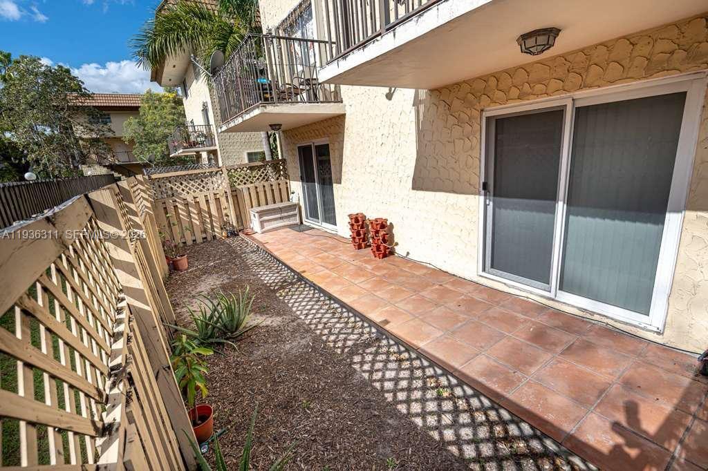 8600 Southwest 109th Avenue, Unit 4114 Miami, FL 33173 - Photo 27 of 44 a view of a house with a yard