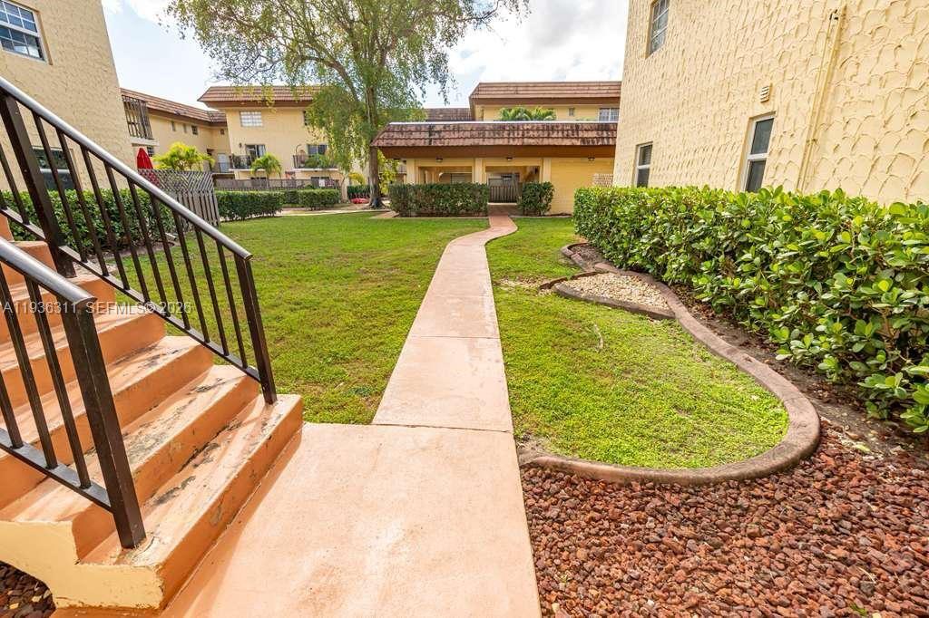 8600 Southwest 109th Avenue, Unit 4114 Miami, FL 33173 - Photo 29 of 44 a view of swimming pool from a balcony