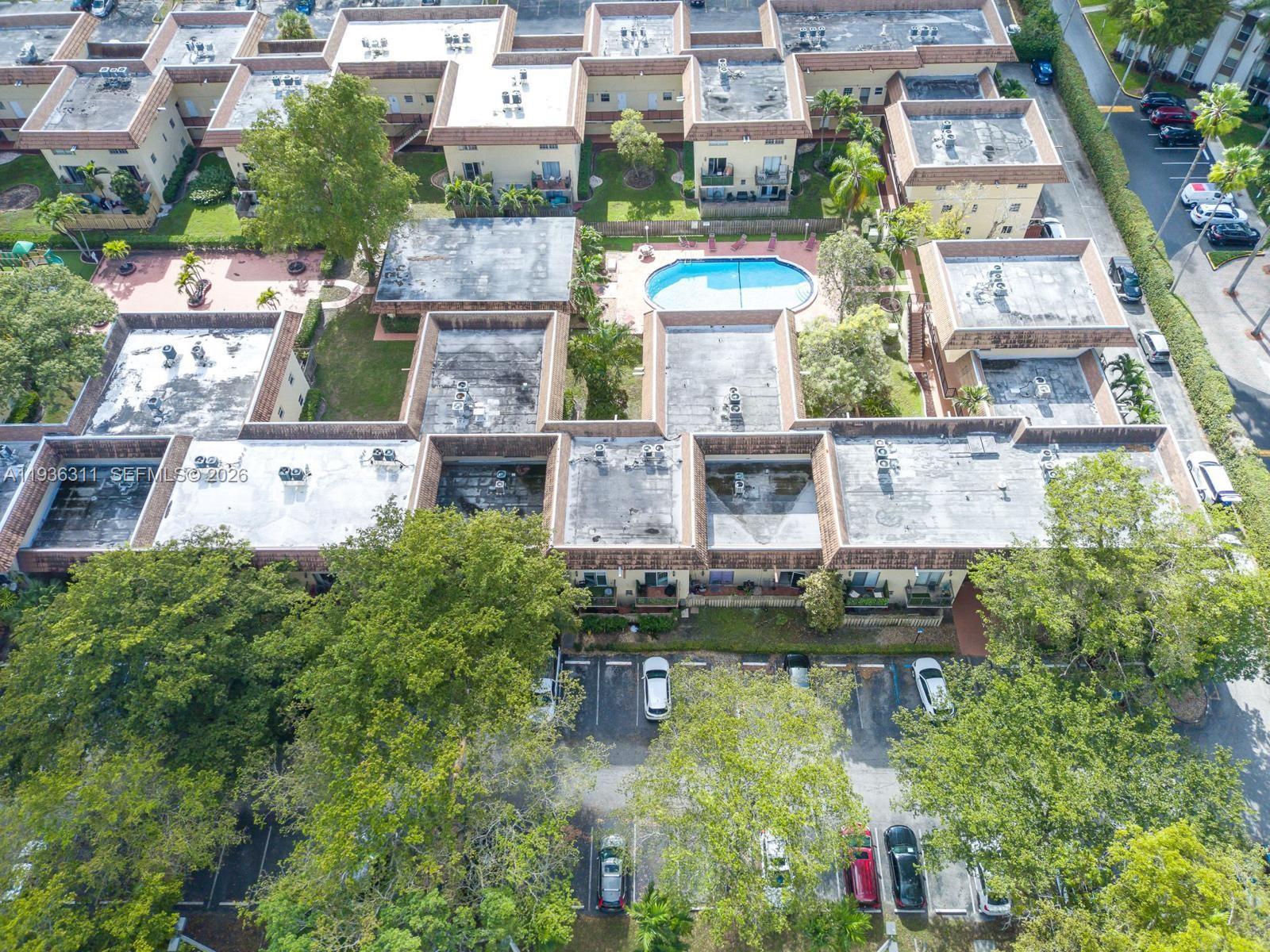 8600 Southwest 109th Avenue, Unit 4114 Miami, FL 33173 - Photo 39 of 44 an aerial view of residential houses with outdoor space and swimming pool