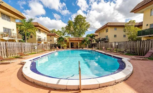 a view of a swimming pool with a chairs