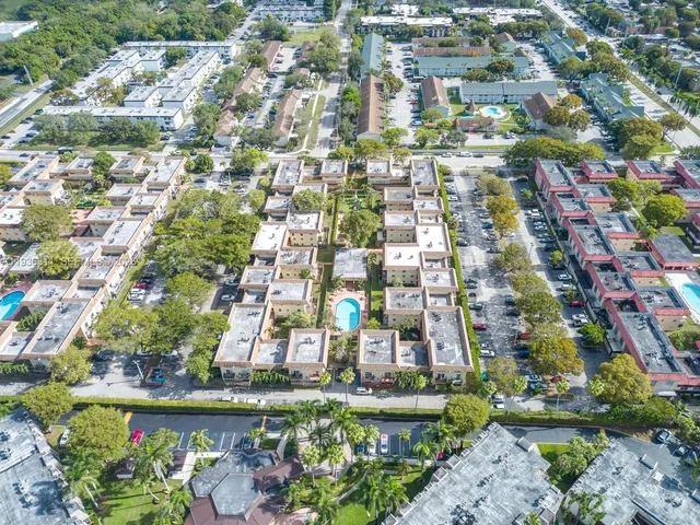 an aerial view of residential houses with outdoor space