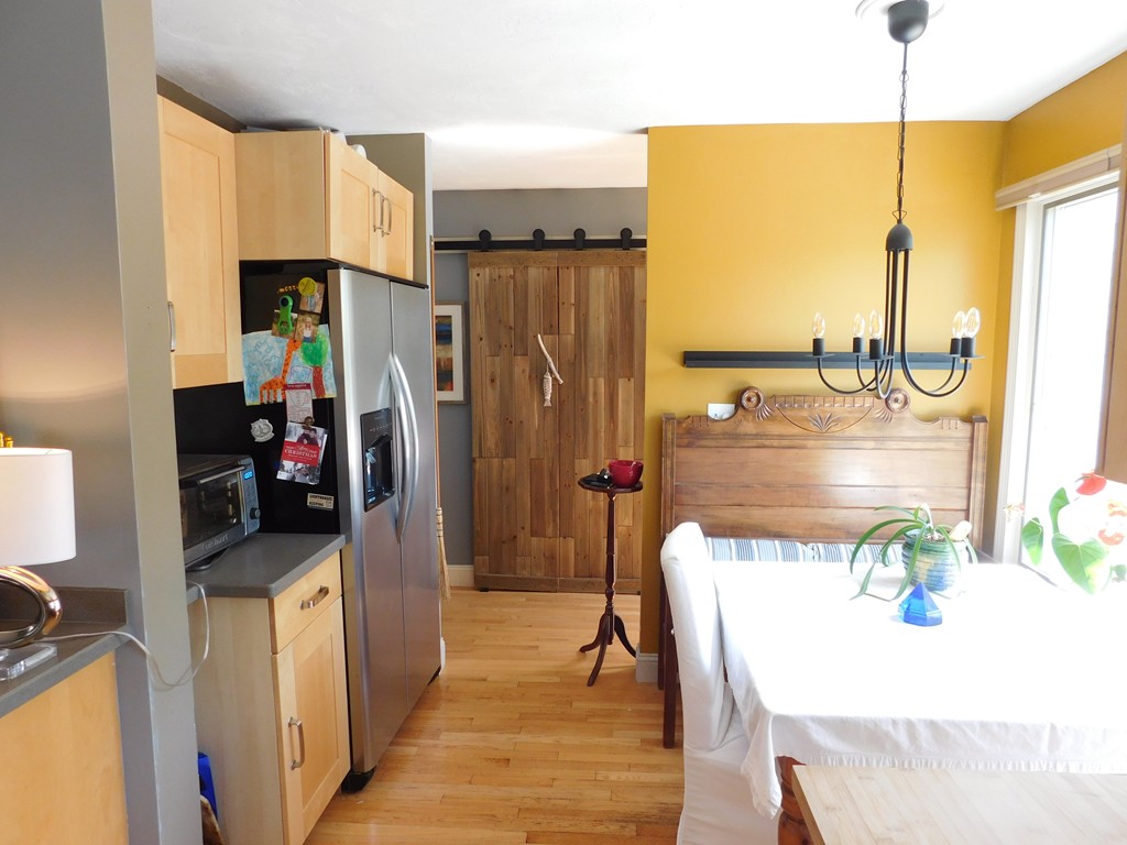 700 Shore Drive, Unit 901 Fall River, MA 02721 - Photo 9 of 19 a kitchen with stainless steel appliances kitchen island granite countertop a refrigerator a stove and a sink with wooden floor
