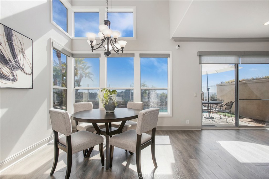 32 Blazewood Lake Forest, CA 92610 - Photo 5 of 41 a view of a dining room with furniture and wooden floor