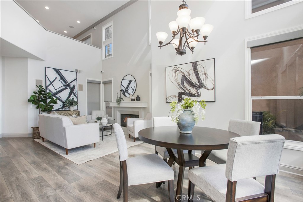 32 Blazewood Lake Forest, CA 92610 - Photo 6 of 41 a view of a dining room with furniture and wooden floor
