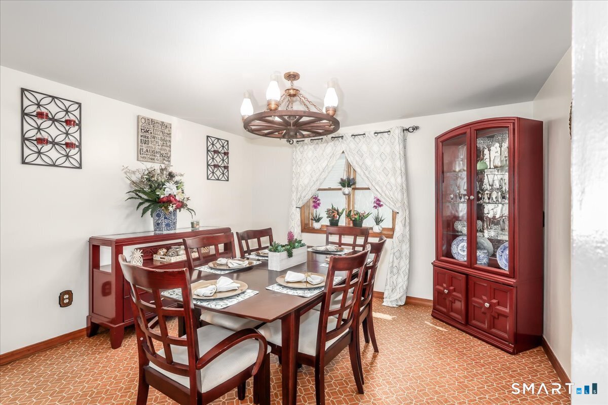 306 Welton Street Hamden, CT 06517 - Photo 7 of 38 a view of a dining room with furniture and chandelier