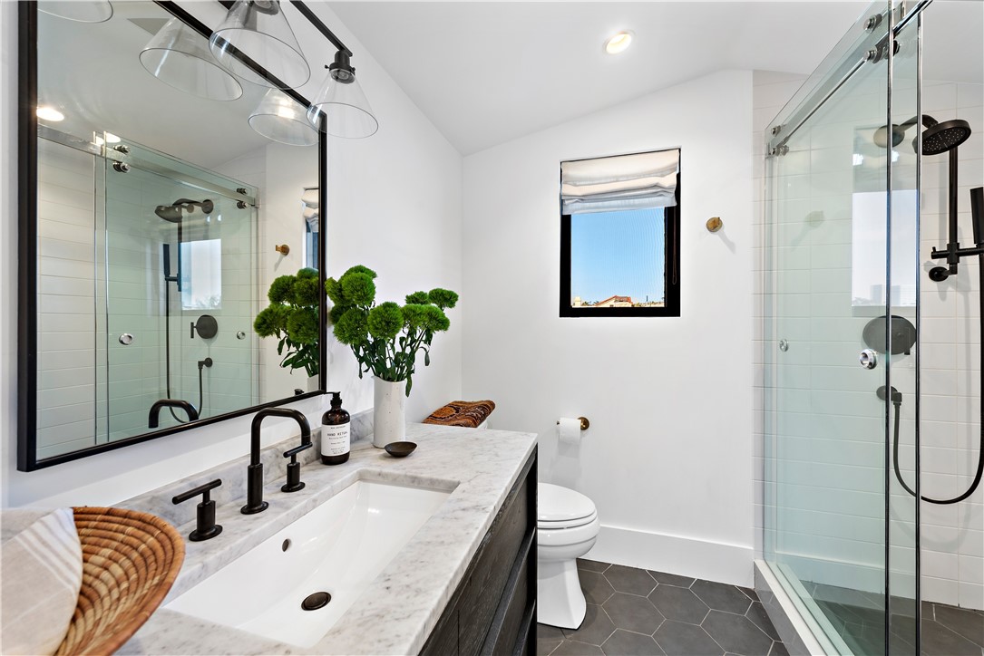 616 1/2 Acacia Avenue Corona del Mar, CA 92625 - Photo 18 of 20 a bathroom with a sink a toilet and shower
