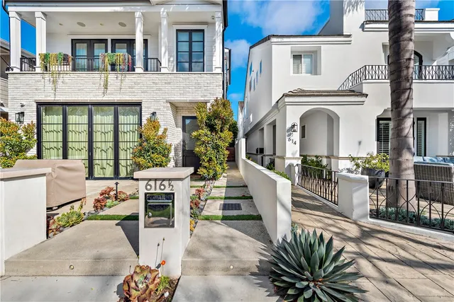 a front view of a building with outdoor seating