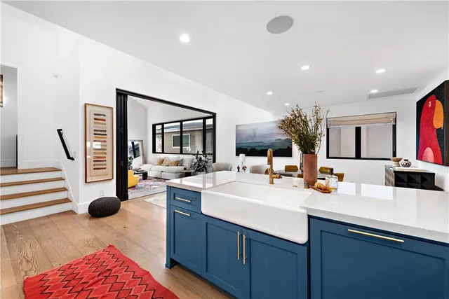 a kitchen with a sink and a stove