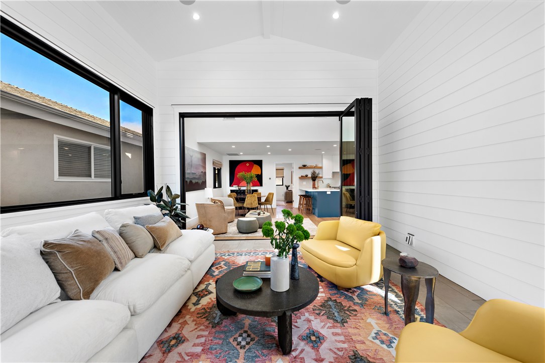 616 1/2 Acacia Avenue Corona del Mar, CA 92625 - Photo 10 of 20 a living room with furniture a rug and a large window