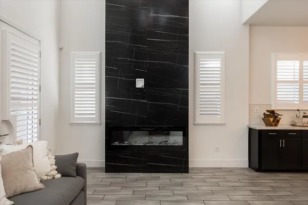 a living room with a couch and a stove top oven