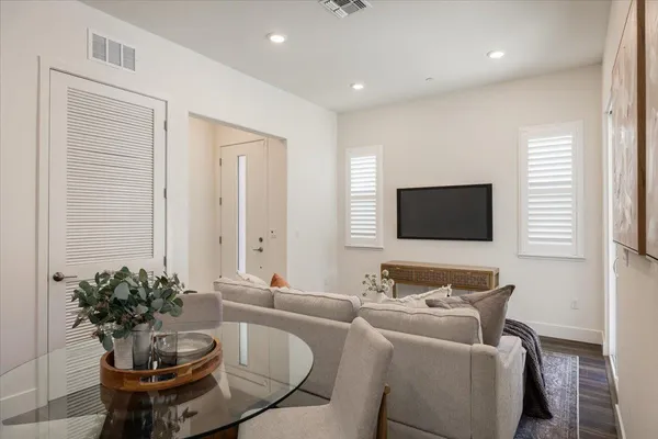 a living room with furniture and a painting