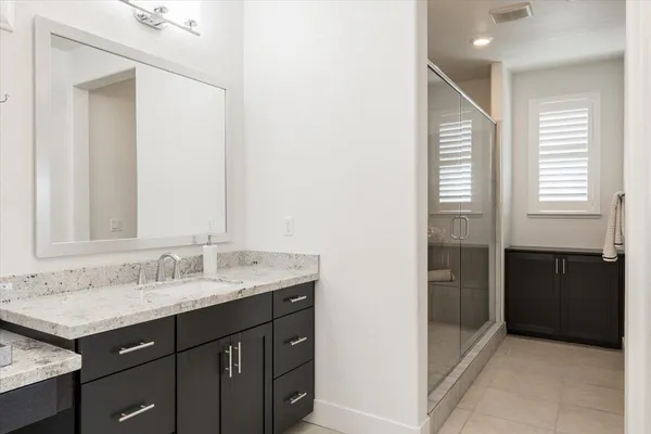 a bathroom with a bathtub and a shower