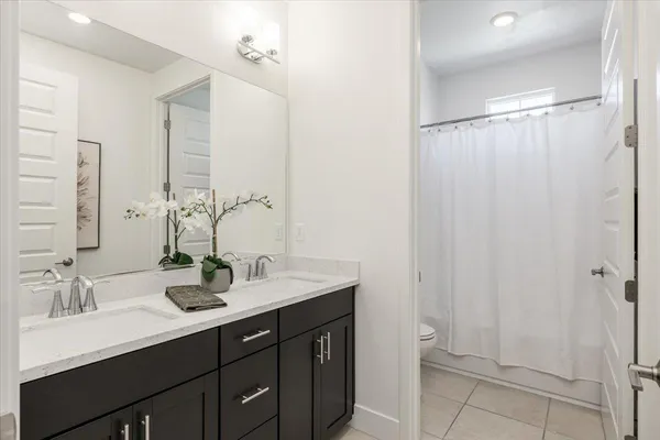 a bathroom with a sink and cabinets