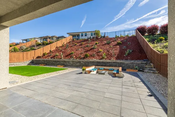 a view of swimming pool with outdoor seating and plants