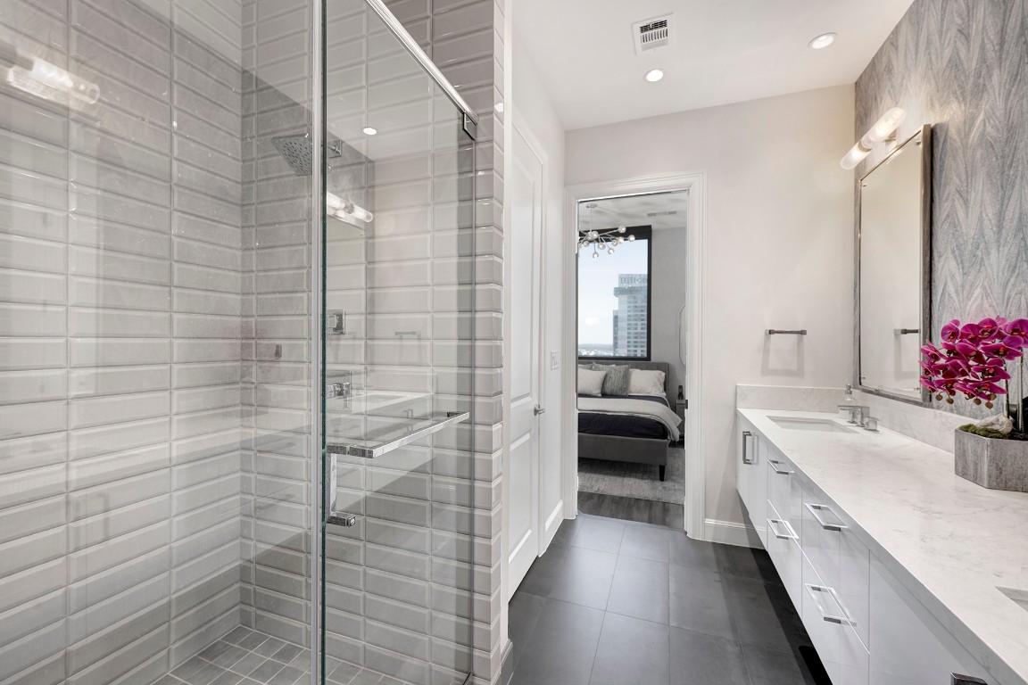 1211 Caroline Street, Unit 1501 Houston, TX 77002 - Photo 13 of 40 Primary bathroom featuring a walk-in shower and a TOTO bidet.