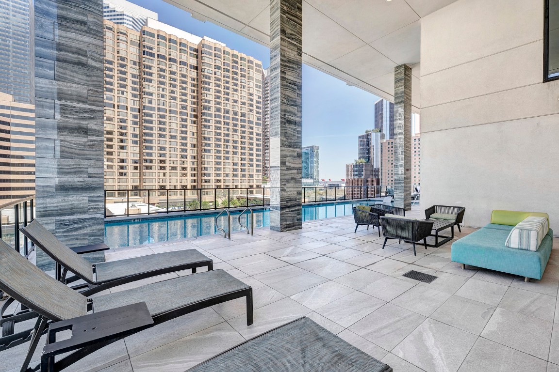 1211 Caroline Street, Unit 1501 Houston, TX 77002 - Photo 29 of 40 Additional view of the terrace pool deck showcasing the relaxing lounge and entertainment spaces.