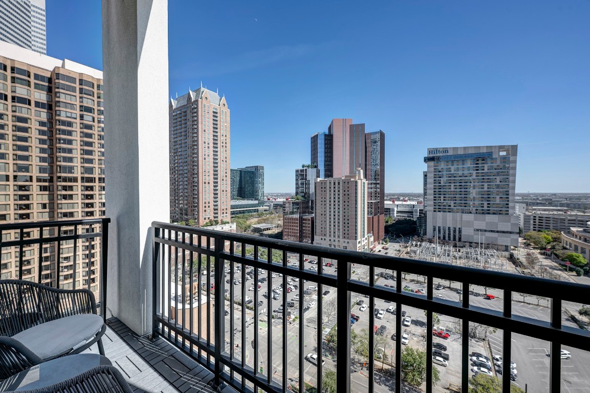 1211 Caroline Street, Unit 1501 Houston, TX 77002 - Photo 5 of 40 Private balcony view overlooking Discovery Green and George R. Brown Convention Center