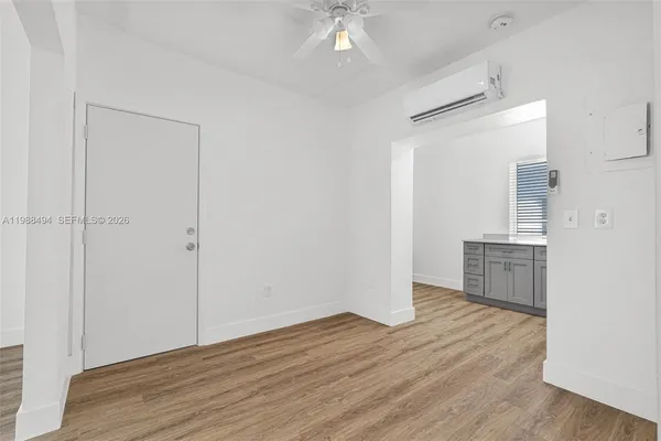 a view of kitchen with furniture and wooden floor