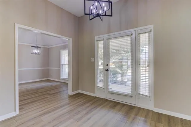 a kitchen with granite countertop white cabinets and stainless steel appliances