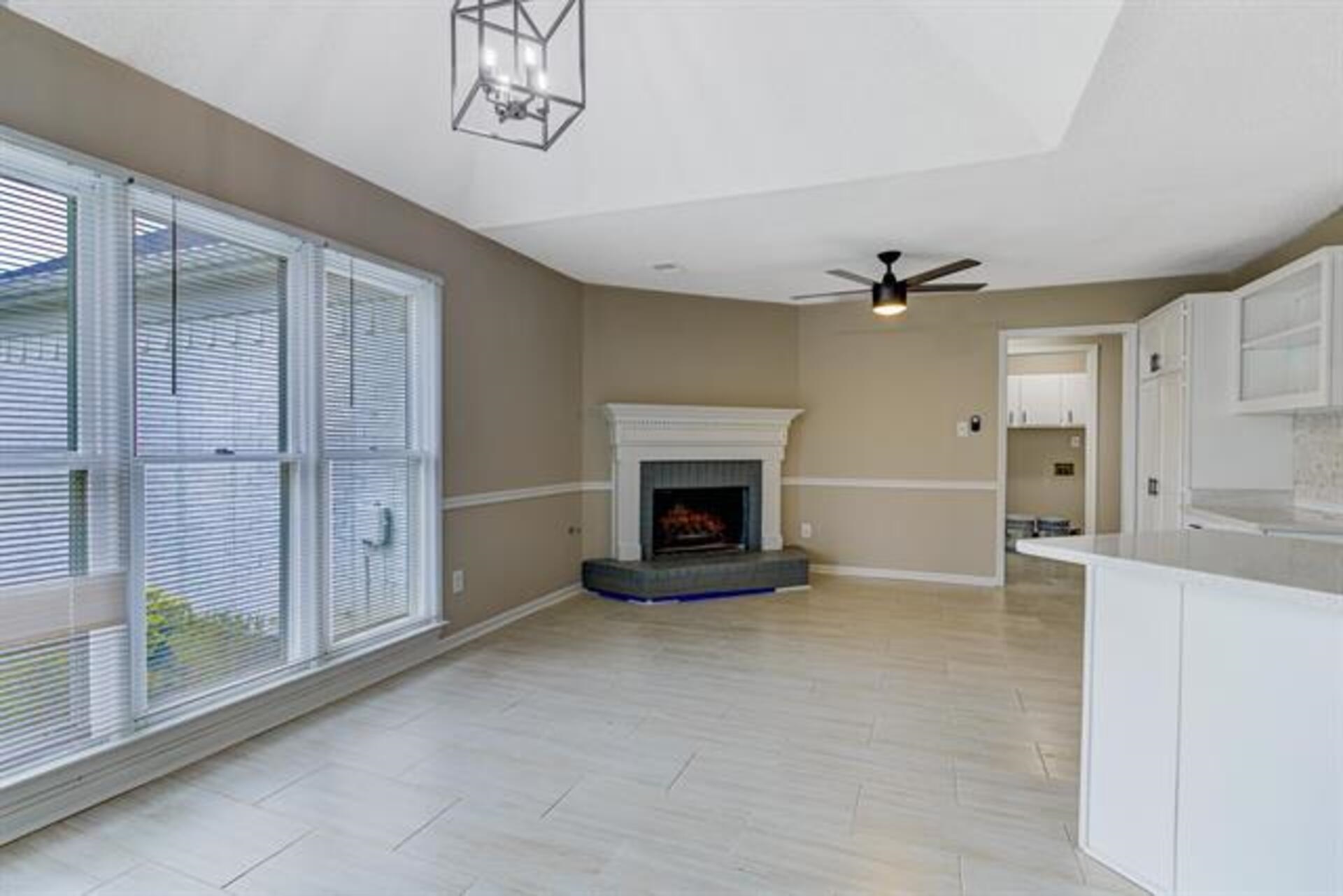 1937 Ada Lane Memphis, TN 38016 - Photo 5 of 28 a view of an empty room with a fireplace and a window