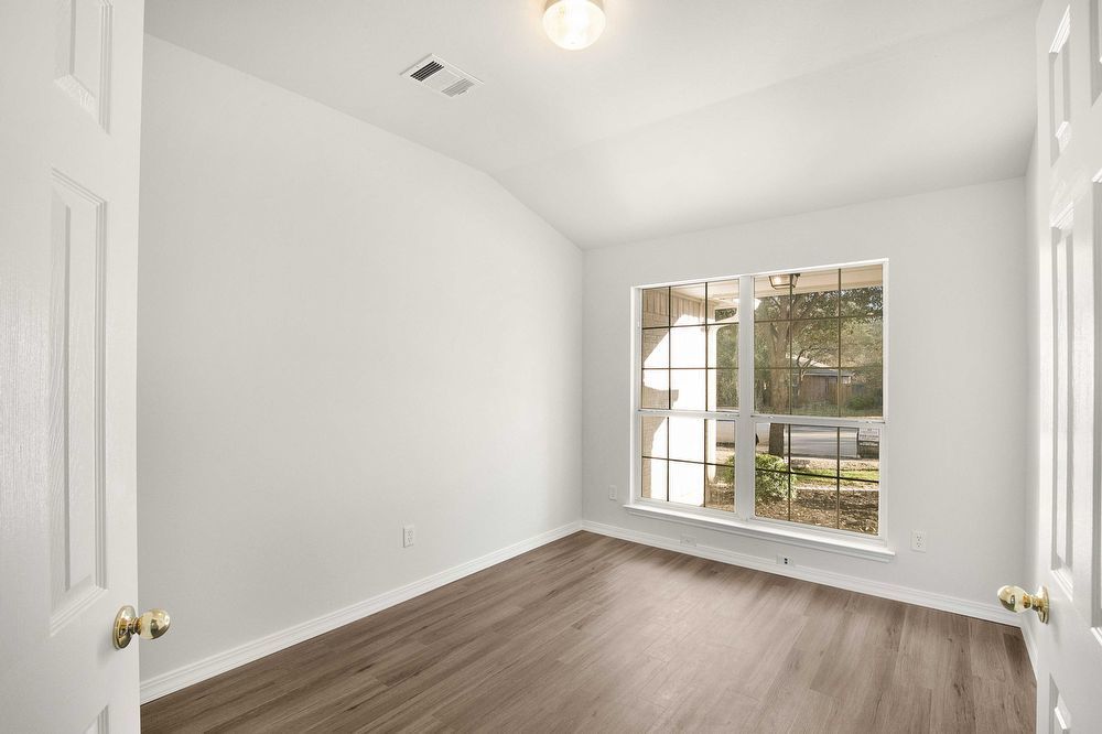 3310 Blue Ridge Drive Round Rock, TX 78681 - Photo 7 of 13 A versatile room with ample natural light, perfect for a quiet study or cozy guest space.