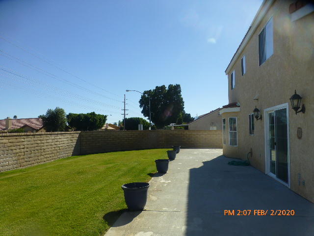 45696 Cimarron Road Indio, CA 92201 - Photo 22 of 26 a view of a house with a yard