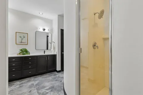 a room with a dresser and a mirror