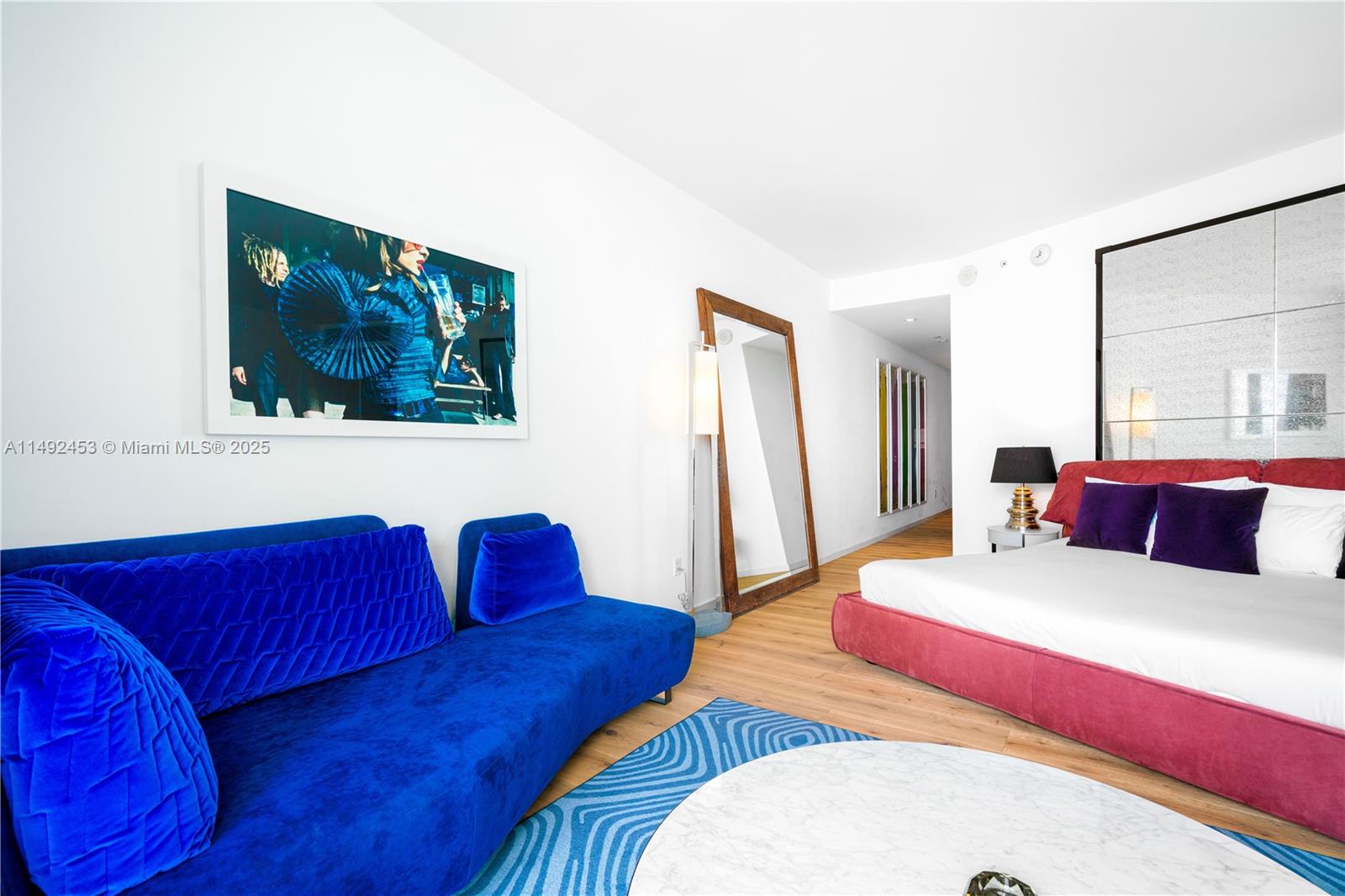 2201 Collins Avenue, Unit 1226 Miami Beach, FL 33139 - Photo 11 of 20 a bedroom with a bed and a couch