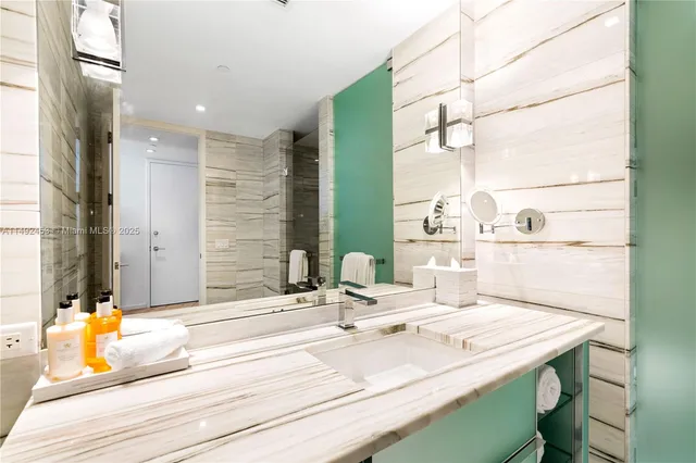 a room with a sink and a mirror