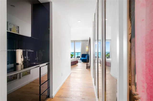 a view of a hallway with living room