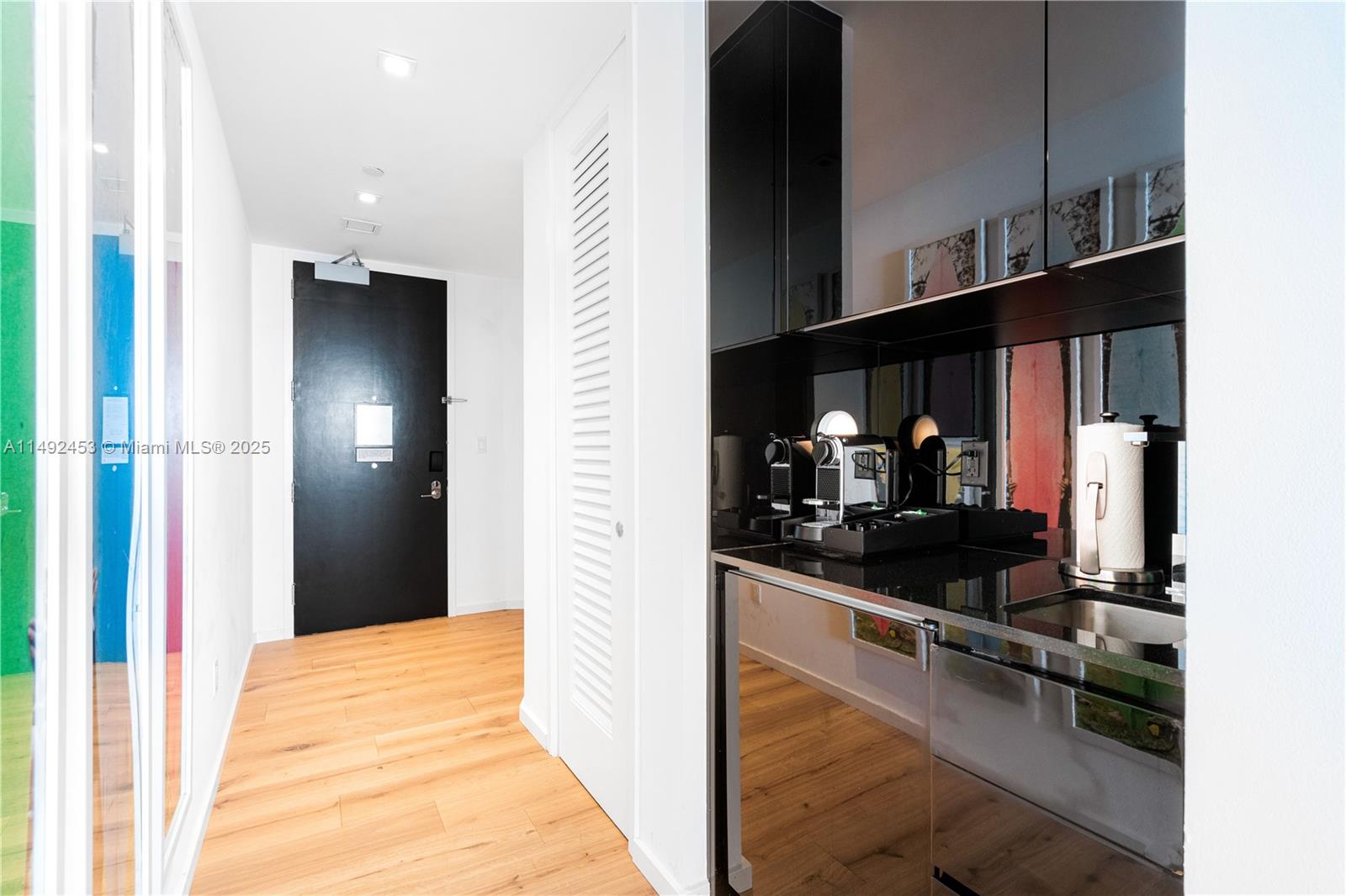 2201 Collins Avenue, Unit 1226 Miami Beach, FL 33139 - Photo 17 of 20 a kitchen with stainless steel appliances granite countertop a refrigerator and a sink
