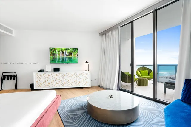 a living room with table and couch