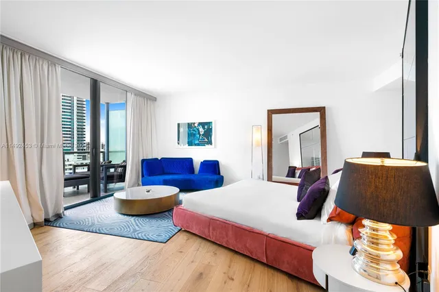 a bedroom with furniture and a window