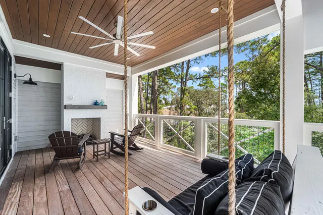 a balcony with furniture and wooden floor