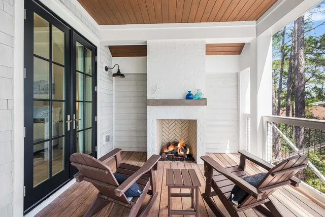 a bedroom with a bed and a flat tv screen on dresser