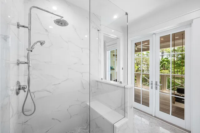 a living room with furniture a flat screen tv and a book shelf