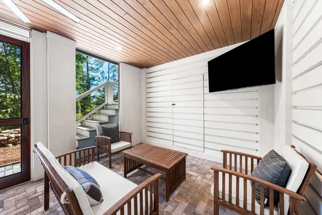 a view of a swimming pool with a patio and yard