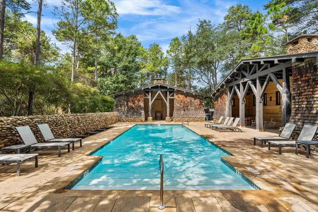a front view of a house with a yard and a garage