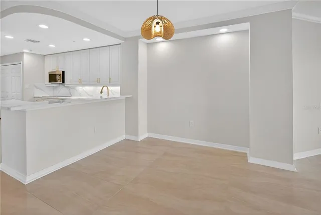 an empty room with a empty space and windows