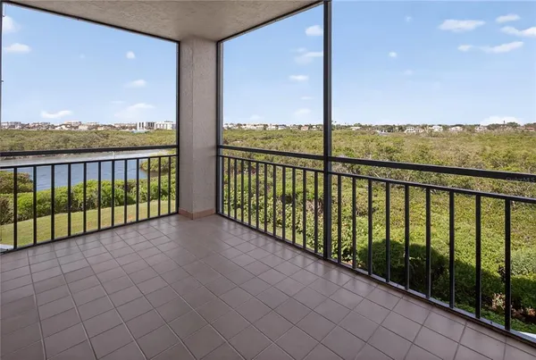a balcony with furniture and rug floor